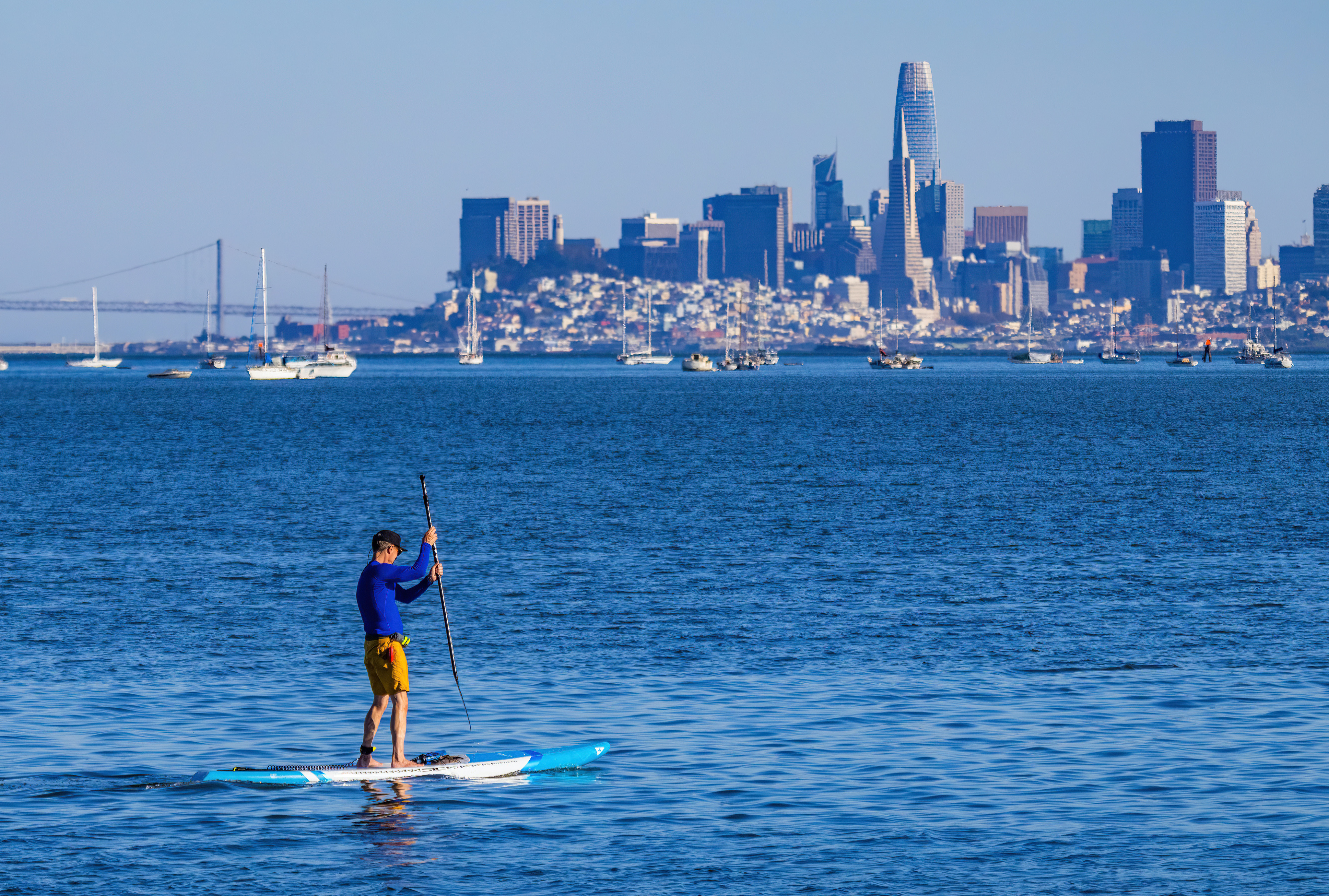 Paddle boarding with view of the city